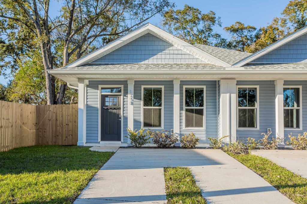 aDoor home with blue and white exterior paint, unique design, maximize your investment.